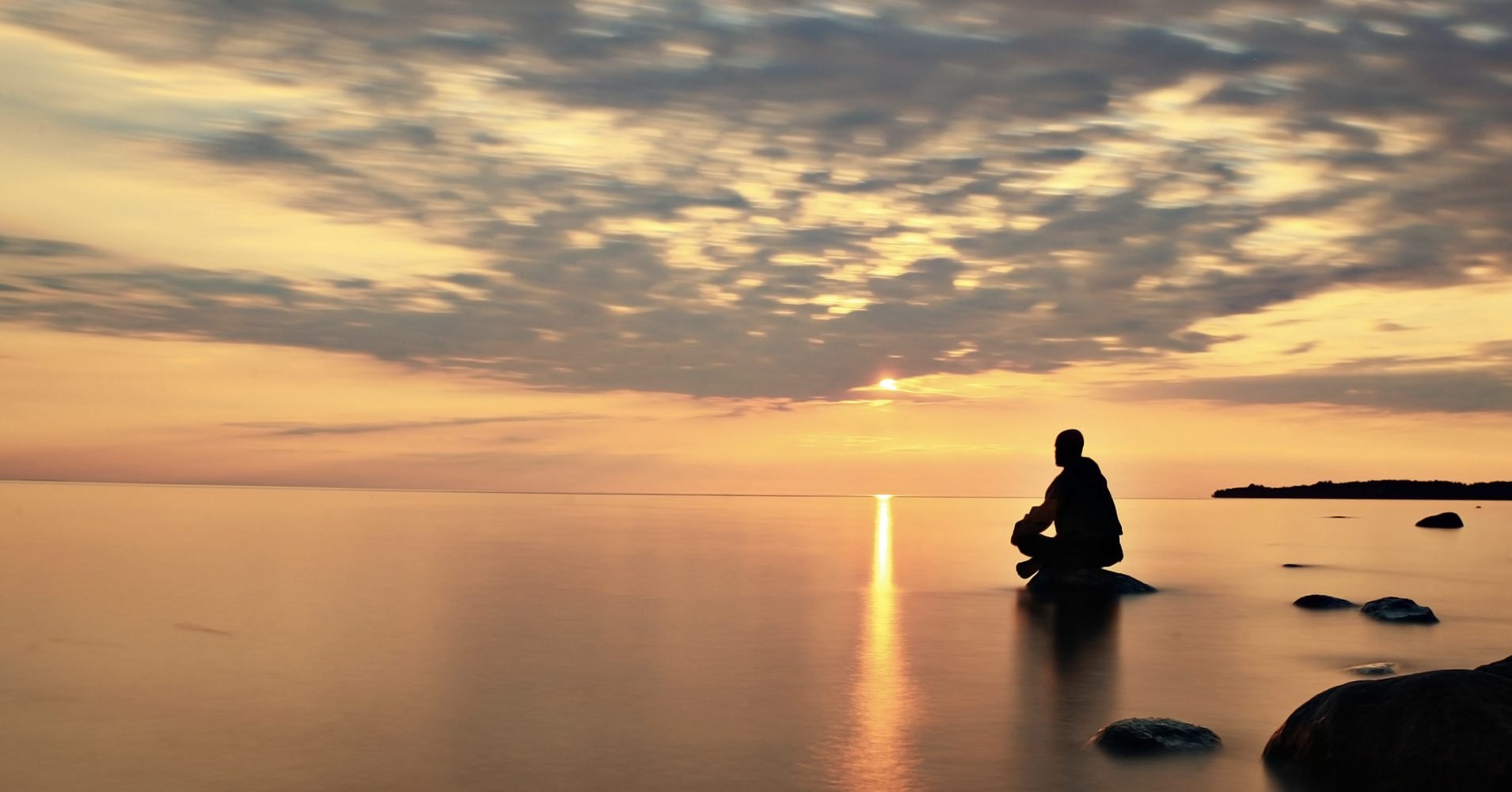 Silhouette of a Muslim in deep contemplation surrounded by tranquil settings