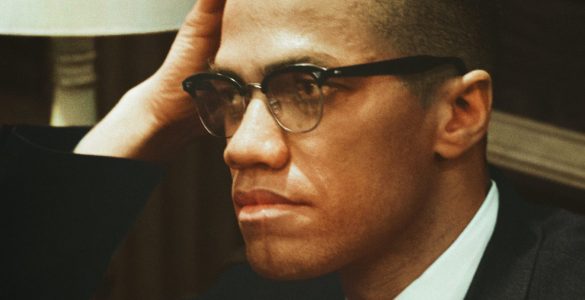 Malcolm X hand on head
