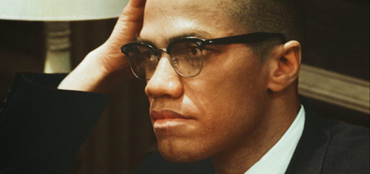 Malcolm X hand on head